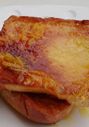 A picture of Bread With Orange Icing.