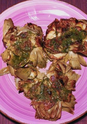 A picture of Grilled Artichokes with Garlic, Oil, and Parsley Dressing.