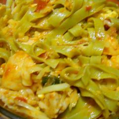 A picture of Chicken and tomato pasta.
