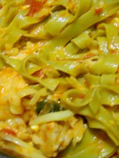 A picture of Chicken and tomato pasta.