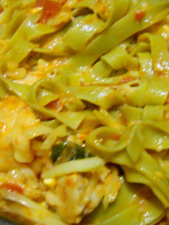 A picture of Chicken and tomato pasta.