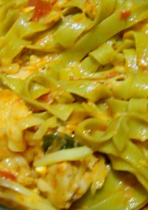A picture of Chicken and tomato pasta.