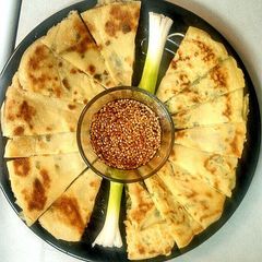 A picture of Scallion Pancakes w/Sesame Dipping Sauce.