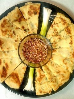 A picture of Scallion Pancakes w/Sesame Dipping Sauce.