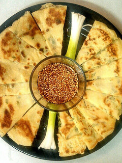 A picture of Scallion Pancakes w/Sesame Dipping Sauce.