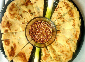 A picture of Scallion Pancakes w/Sesame Dipping Sauce.