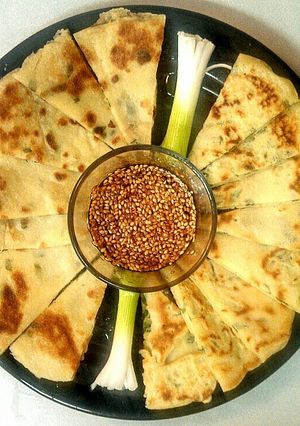 A picture of Scallion Pancakes w/Sesame Dipping Sauce.