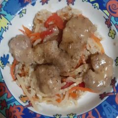 Glazed pork chops with sautéed rice A picture of Glazed pork chops with sautéed rice.