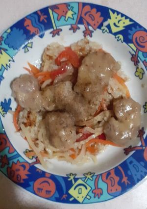 A picture of Glazed pork chops with sautéed rice.