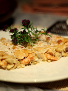 Una foto de Canelones Gratinados de Bacalao y Langostinos