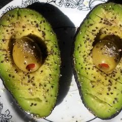 A picture of Avocado w/ olive juice.
