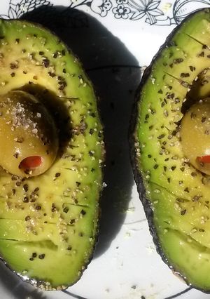 A picture of Avocado w/ olive juice.