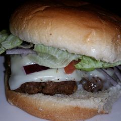 A picture of loaded burgers.