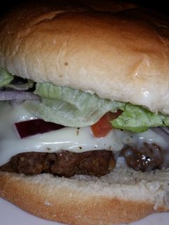A picture of loaded burgers.