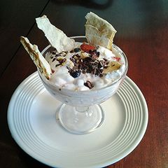 A picture of Eton Mess-- An English dessert of Meringue, Cream and Strawberries.