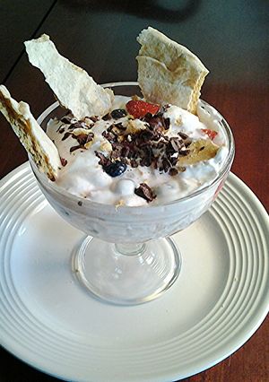 A picture of Eton Mess-- An English dessert of Meringue, Cream and Strawberries.