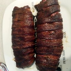 A picture of Bacon wrapped pork tenderloin.