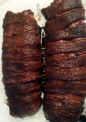 A picture of Bacon wrapped pork tenderloin.