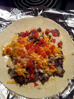 A picture of Donair meat and sauce.
