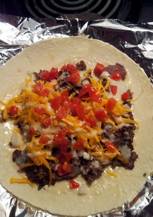 A picture of Donair meat and sauce.
