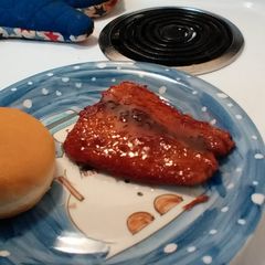 A picture of fried BBQ salmon sandwich.