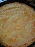 Cheesy cornbread in a cast iron pan