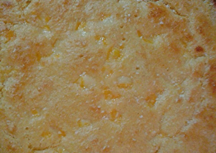Cheesy cornbread in a cast iron pan