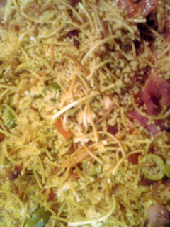 A picture of couscous with herbs and bacon.