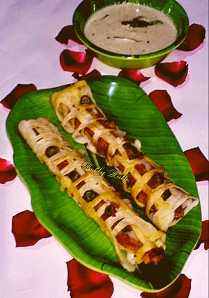 A picture of Net masala dosa roll with coconut peanut chutney.