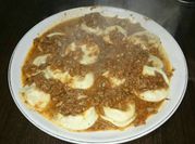 Una foto de filet de merluza con queso crema