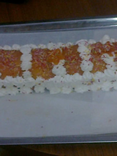 Una foto de Brazo de gitano relleno de crema de ron