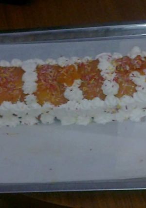 Una foto de Brazo de gitano relleno de crema de ron