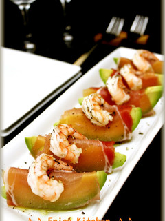 A picture of Grapefruit and Avocado Wrapped In Cured Ham.