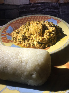 A picture of Garri and Egwusi soup.