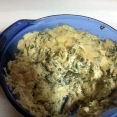 A picture of spinach and artichoke with shredded chicken.