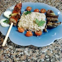 A picture of skewered pork with intire rice.