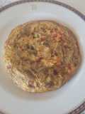Tortilla con alcachofas, verduras y sofrito de tomate