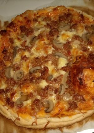 Una foto de Pizza hojaldre de sobras de los tomates rellenos