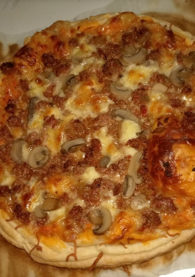 Una foto de Pizza hojaldre de sobras de los tomates rellenos