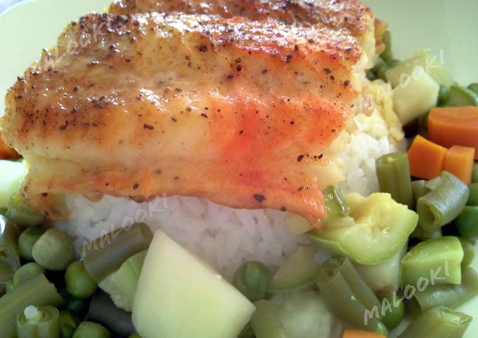Broiled white fish over rice and vegetables