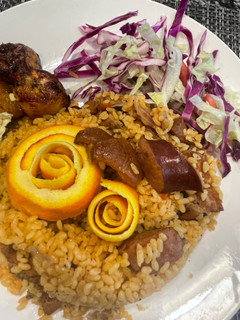 A picture of Dominican rice with pork and sausage.