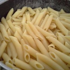 A picture of Penne with vegetables.