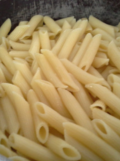 A picture of Penne with vegetables.