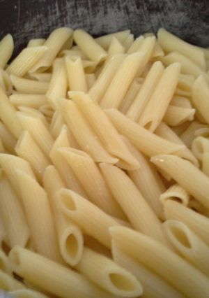 A picture of Penne with vegetables.