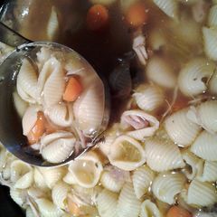 A picture of Chicken and shells crockpot soup.