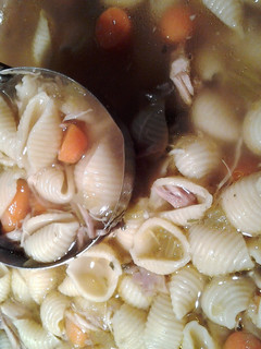A picture of Chicken and shells crockpot soup.