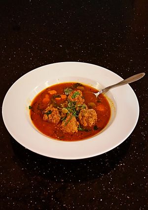 A picture of Meatballs in Tomato Vegetable Broth.
