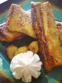 A picture of French Toast Banana Fosters Roll-Ups.