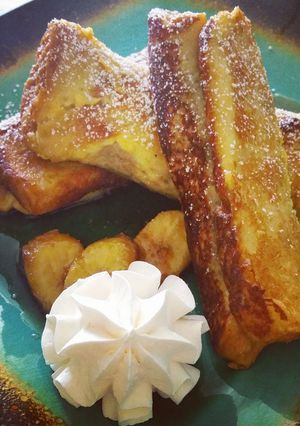 A picture of French Toast Banana Fosters Roll-Ups.