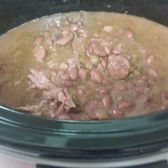 A picture of Slow CookRed beans with Andouille Sausages & Smoke Neck bones.